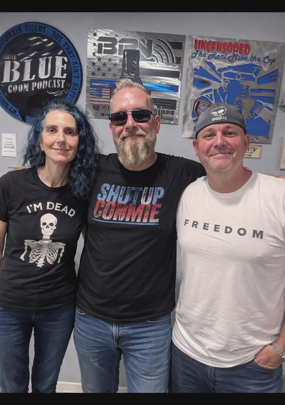 Mike, Blue and Moe posing together in a picture at the studio.