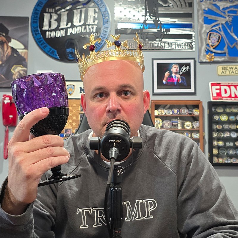 Moe with a Burger King crown on looking serious.